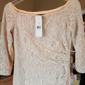 Beige lace floor-length gown. Has original tags.